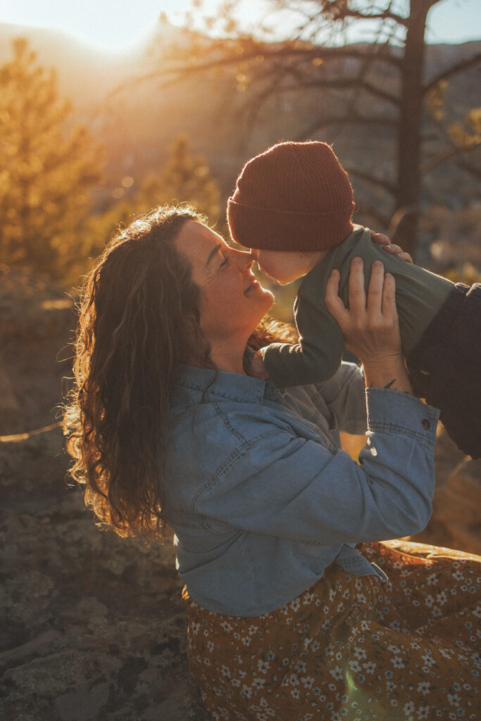 Close-up of couple kissing in warm golden hour light outdoors